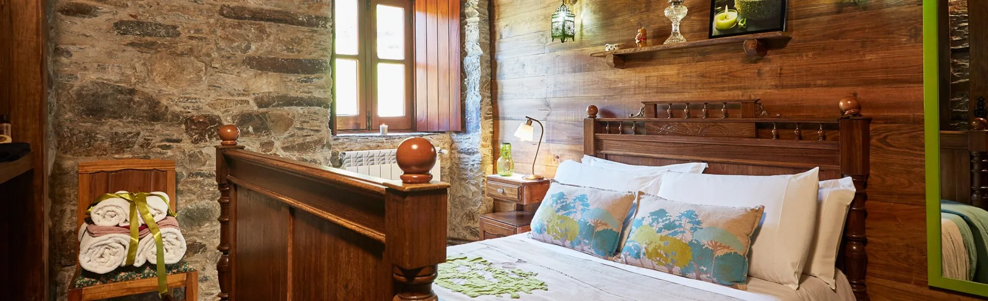 Bedroom with a double bed made up with bed linen and towels