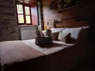 A bedroom with a double bed